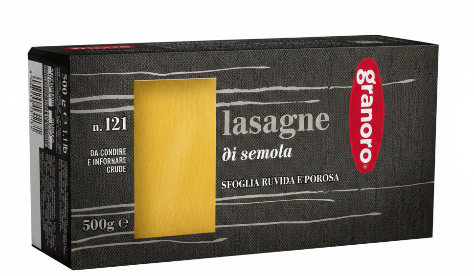 Box of Granoro lasagne pasta with a yellow lasagne sheet on a black background