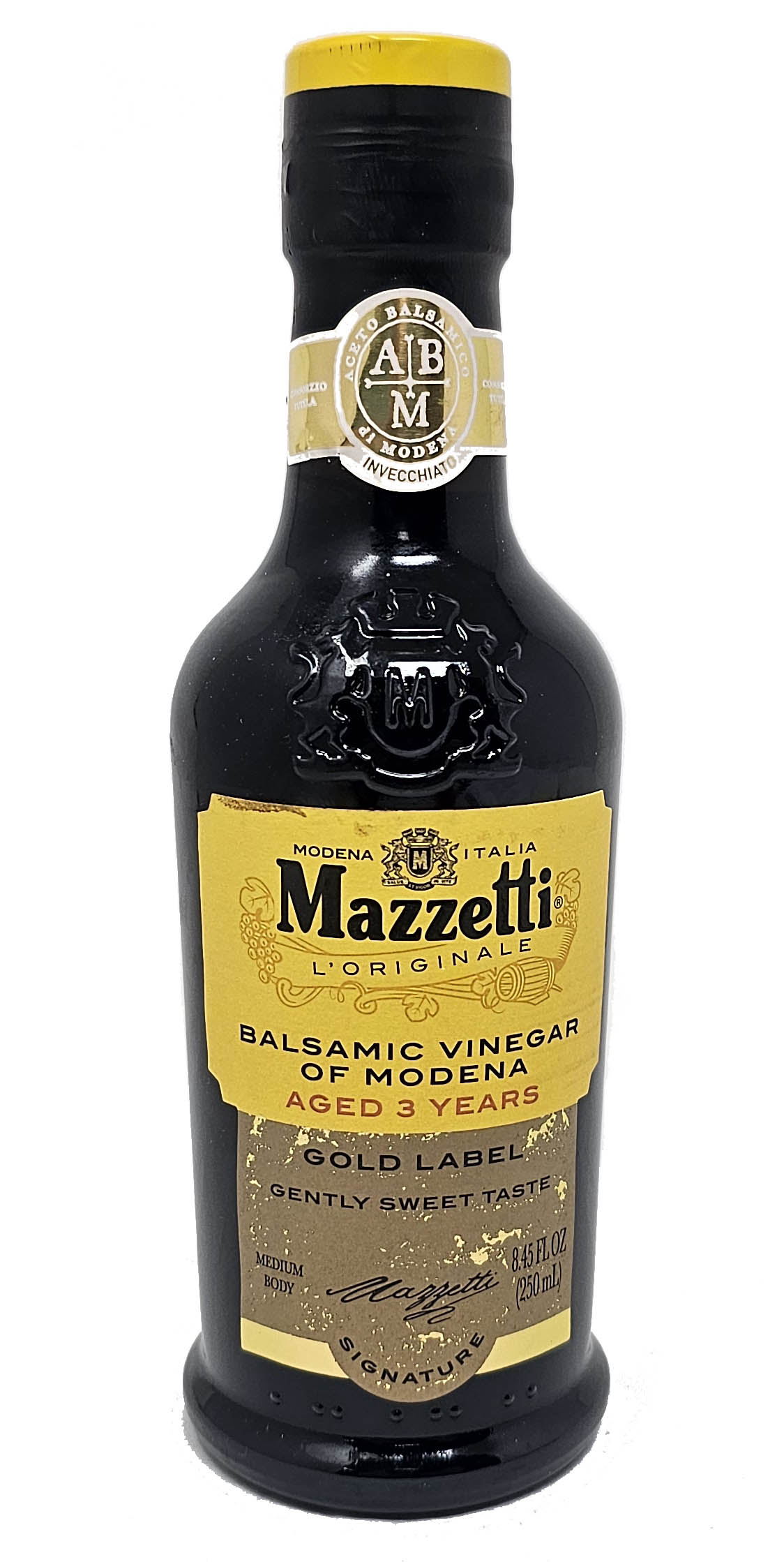 A bottle of Mazzetti Balsamic Vinegar of Modena, Gold Label, on a plain white background. The bottle is dark glass with a bright yellow cap and a yellow and gold label.