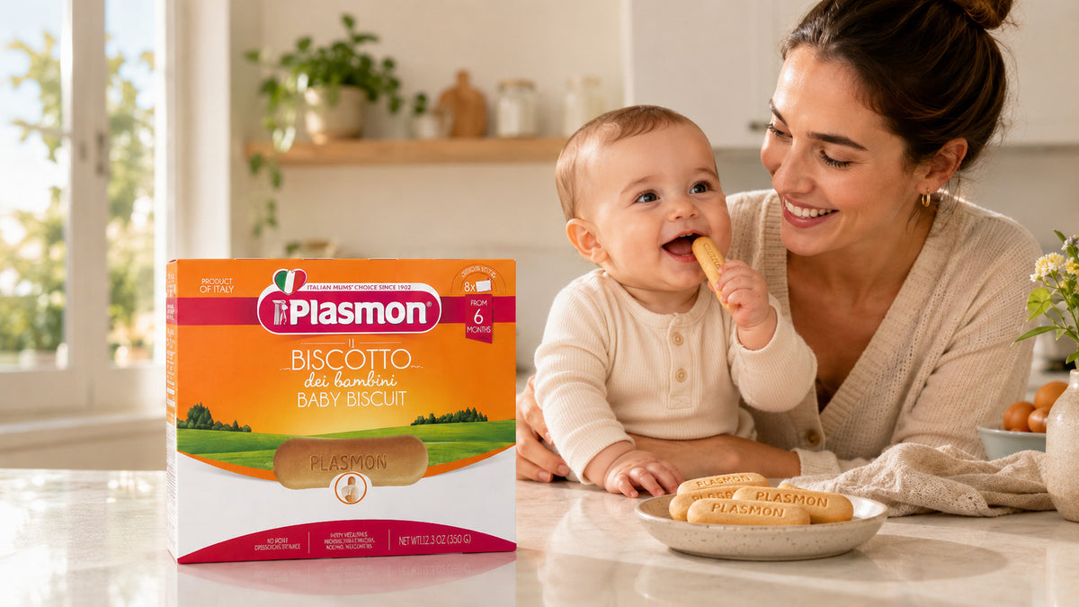 Woman feeding a baby cookies with Plasmon biscotti packaging in the foreground.