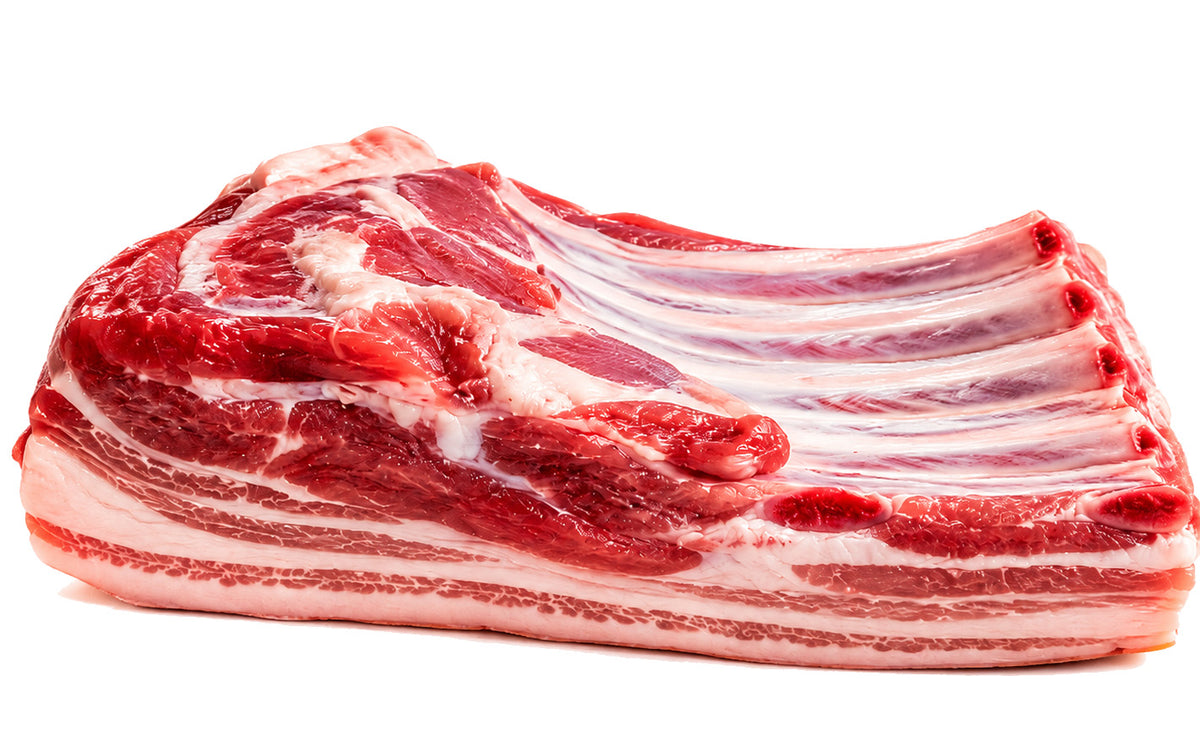 Fresh bone-in pork belly with rib bones and rich marbling for roasting