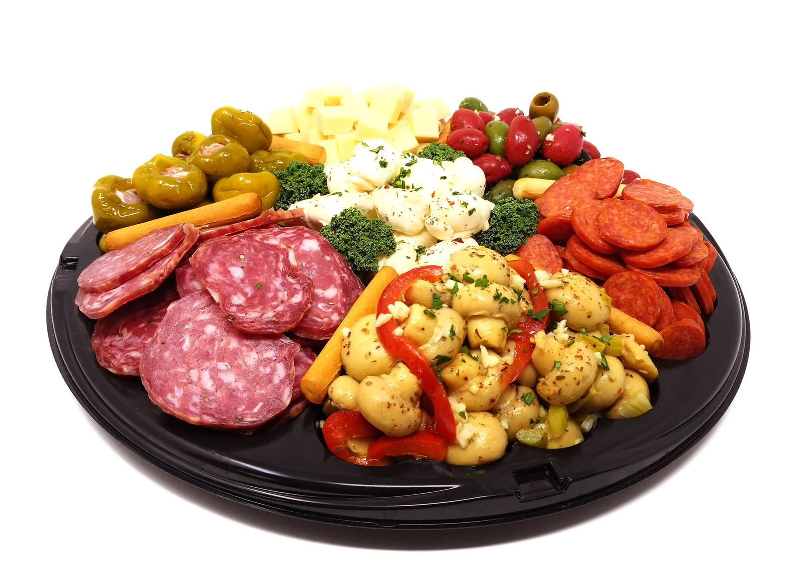 Assorted antipasto, cheeses, and vegetables on a black platter with a white background