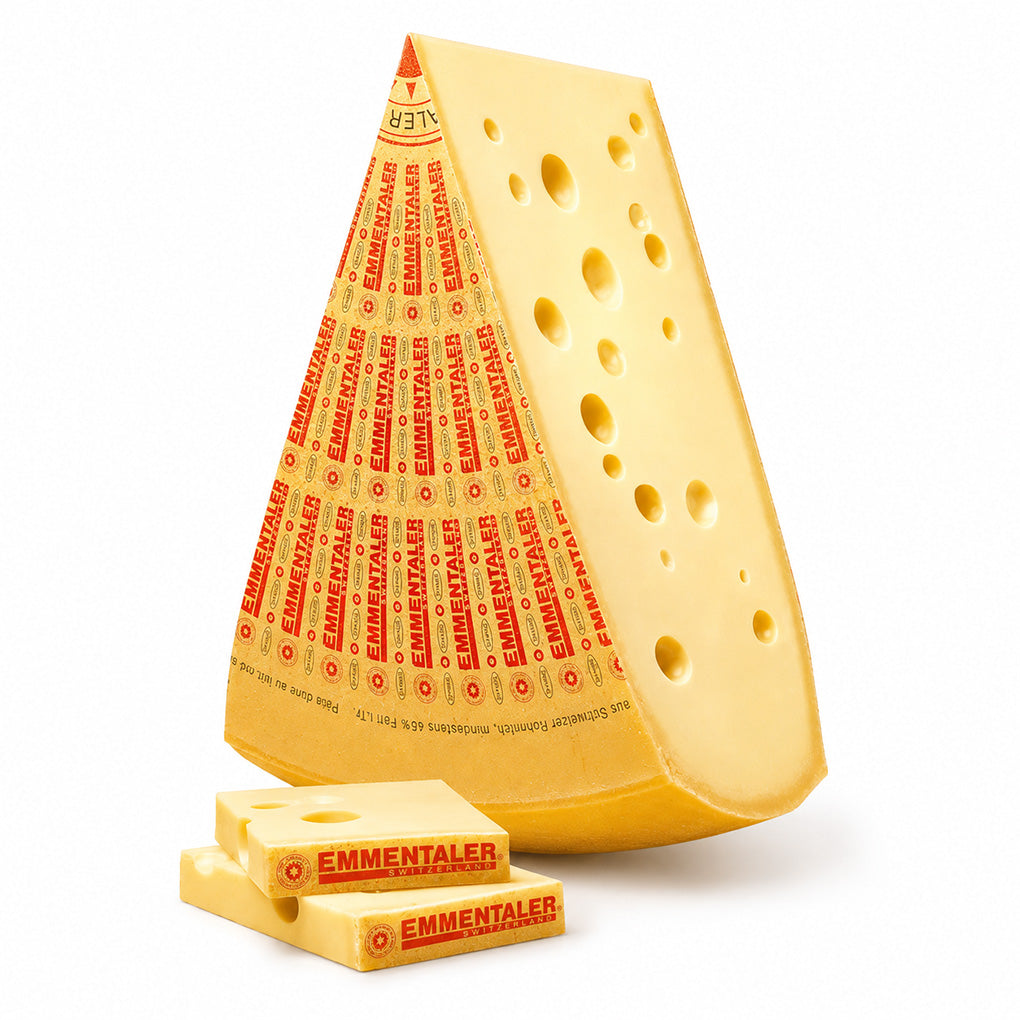 A wedge of Emmentaler cheese, shown with two smaller cheese blocks in front