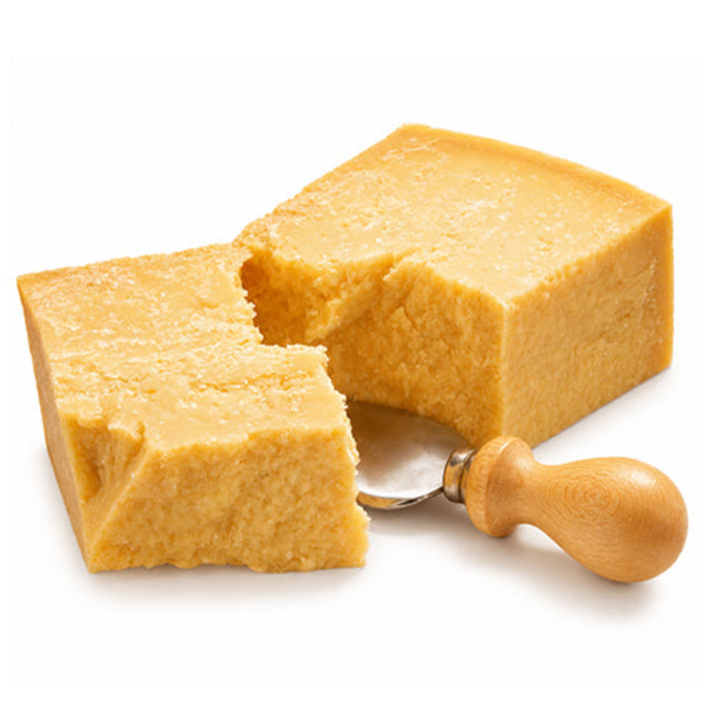 Grana Padano cheese pieces beside a wooden-handled cheese knife.
