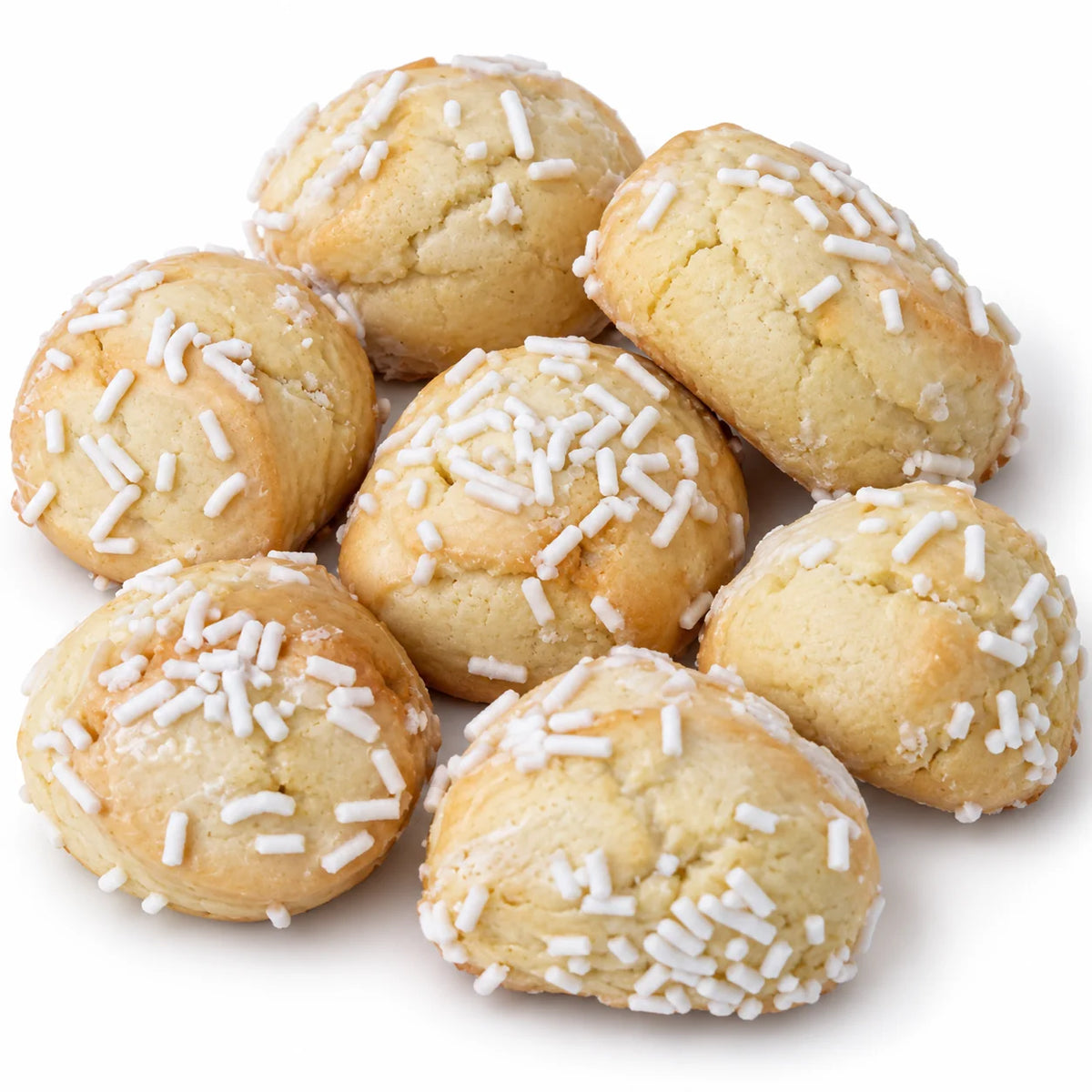 Soft glazed cannoli cookies with white sprinkles on a white background