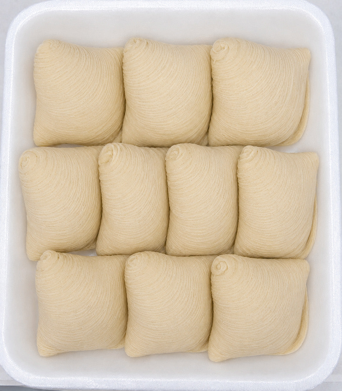 Neatly arranged no sugar added mini sfogliatelle in a white container