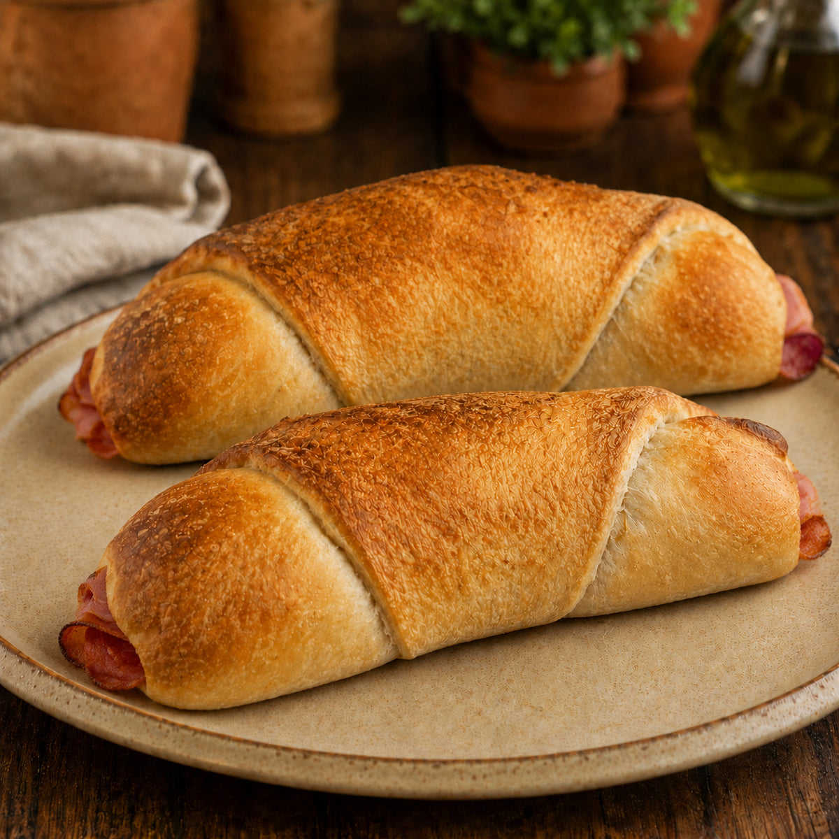 Stromboli whole stuffed with melted cheese and sliced pepperoni, served on a plate