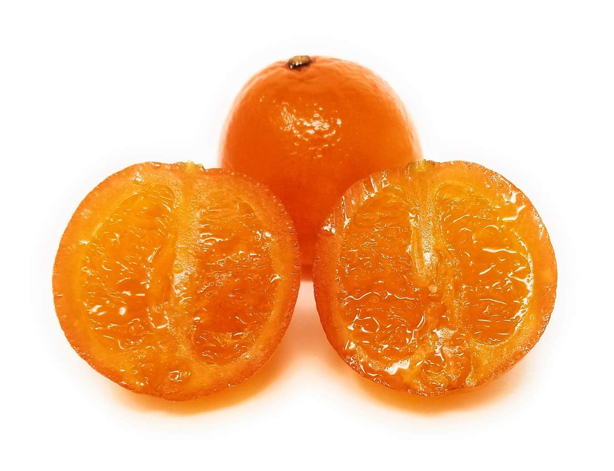 Cross section of three whole candied oranges.
