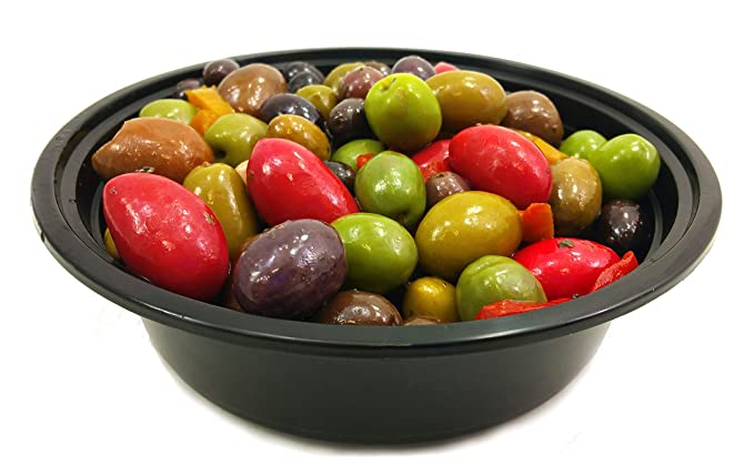A variety of seasoned olives in a black bowl, including green and black olives, as well as olives with a red appearance, likely a mix of different varieties.